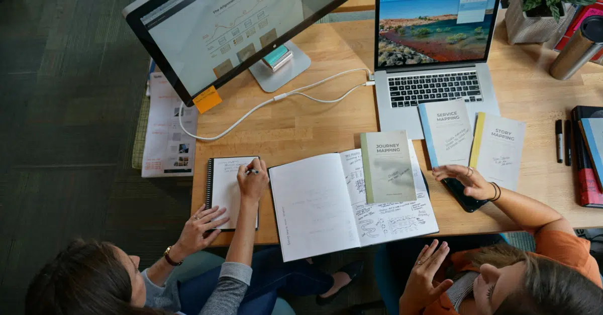 Image of brainstorming team members discussing custom software development myths that aren't true anymore.
